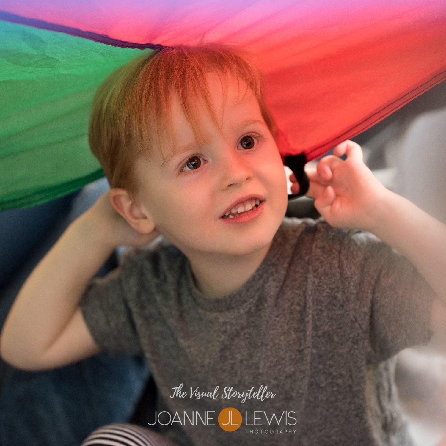Young boy playing parachute games