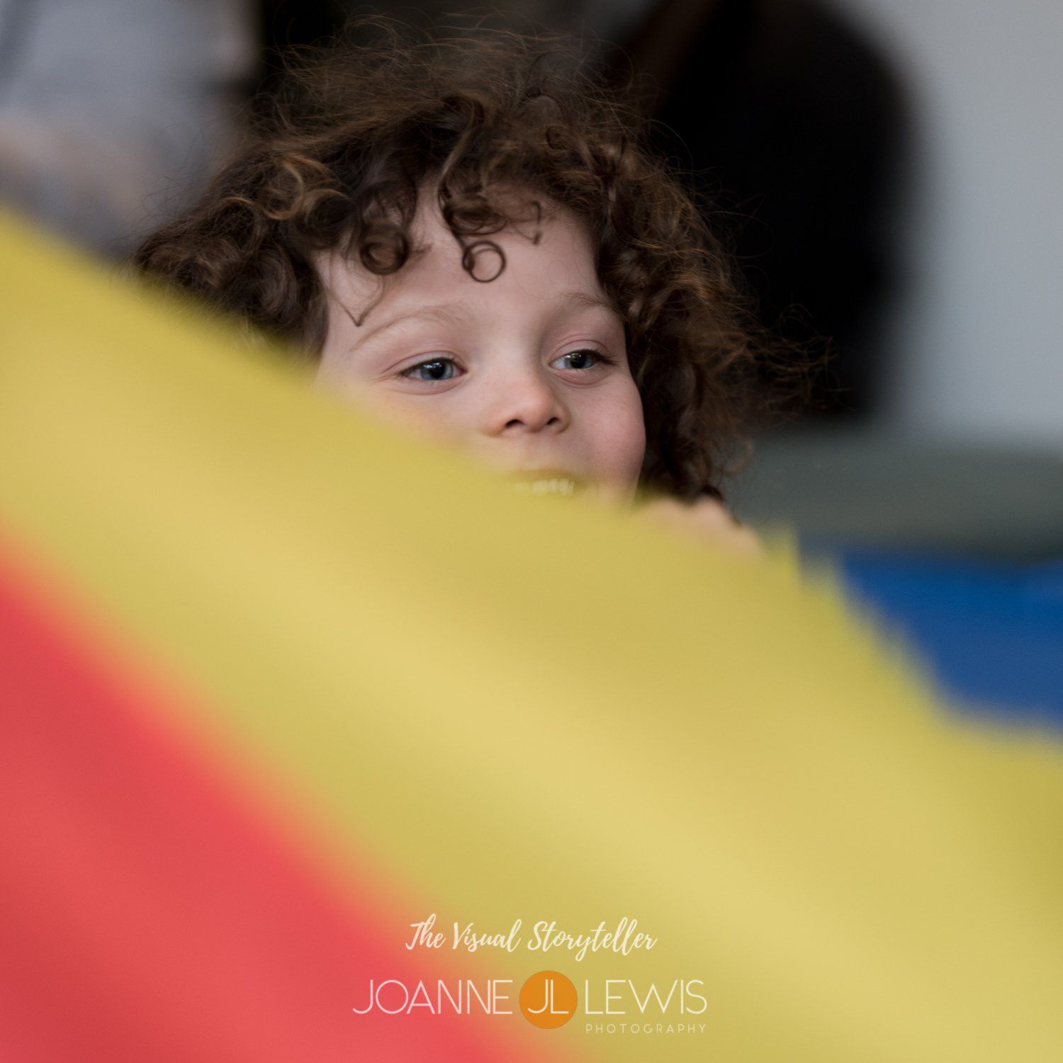 boy with curly hair playing tent games