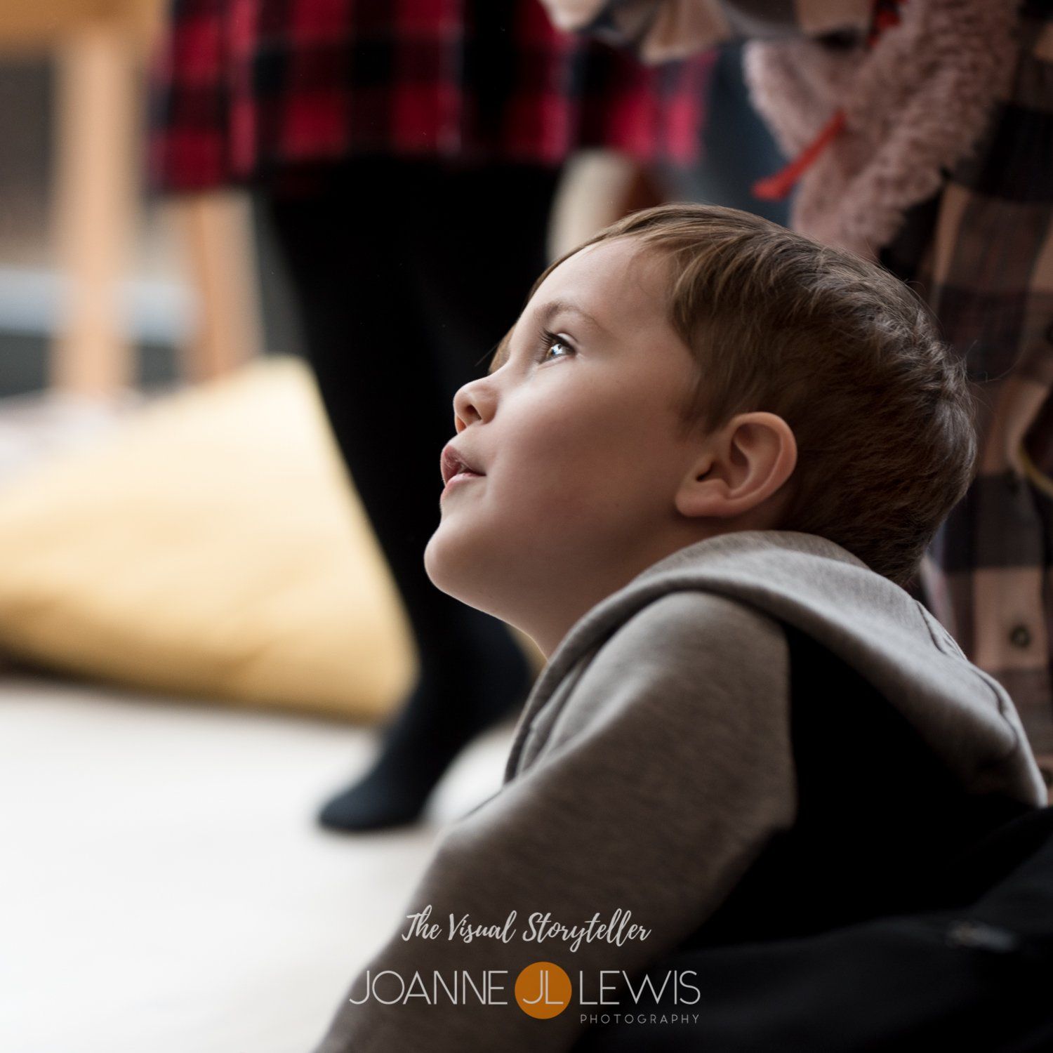Young boy watching party entertainer blowing bubbles during birthday party games with Melody Monkey in Hertford