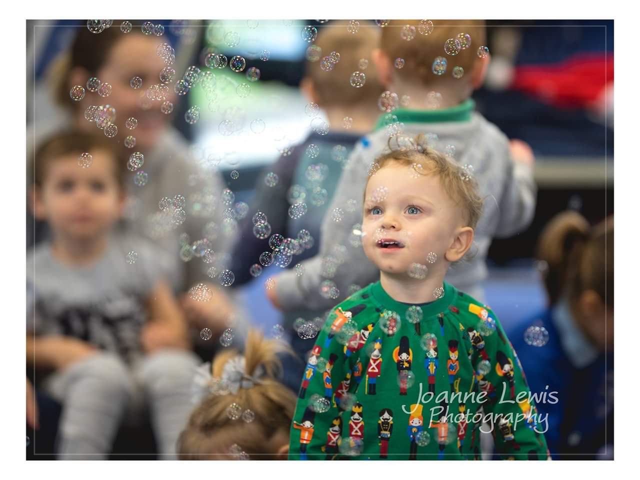 Boy popping bubbles at Melody Monkeys SEND toddler group