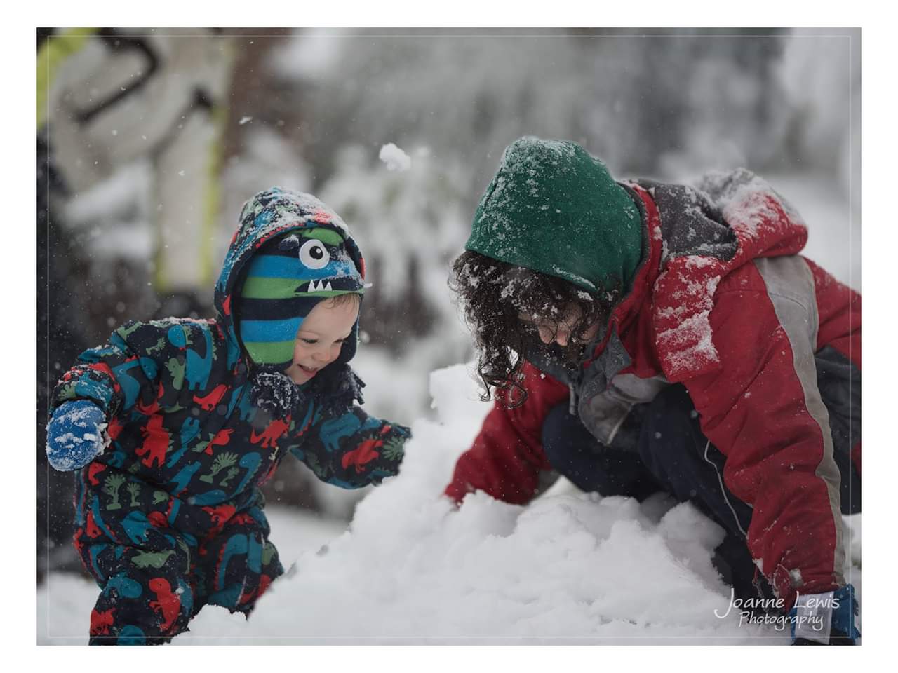 Boys making a snowman