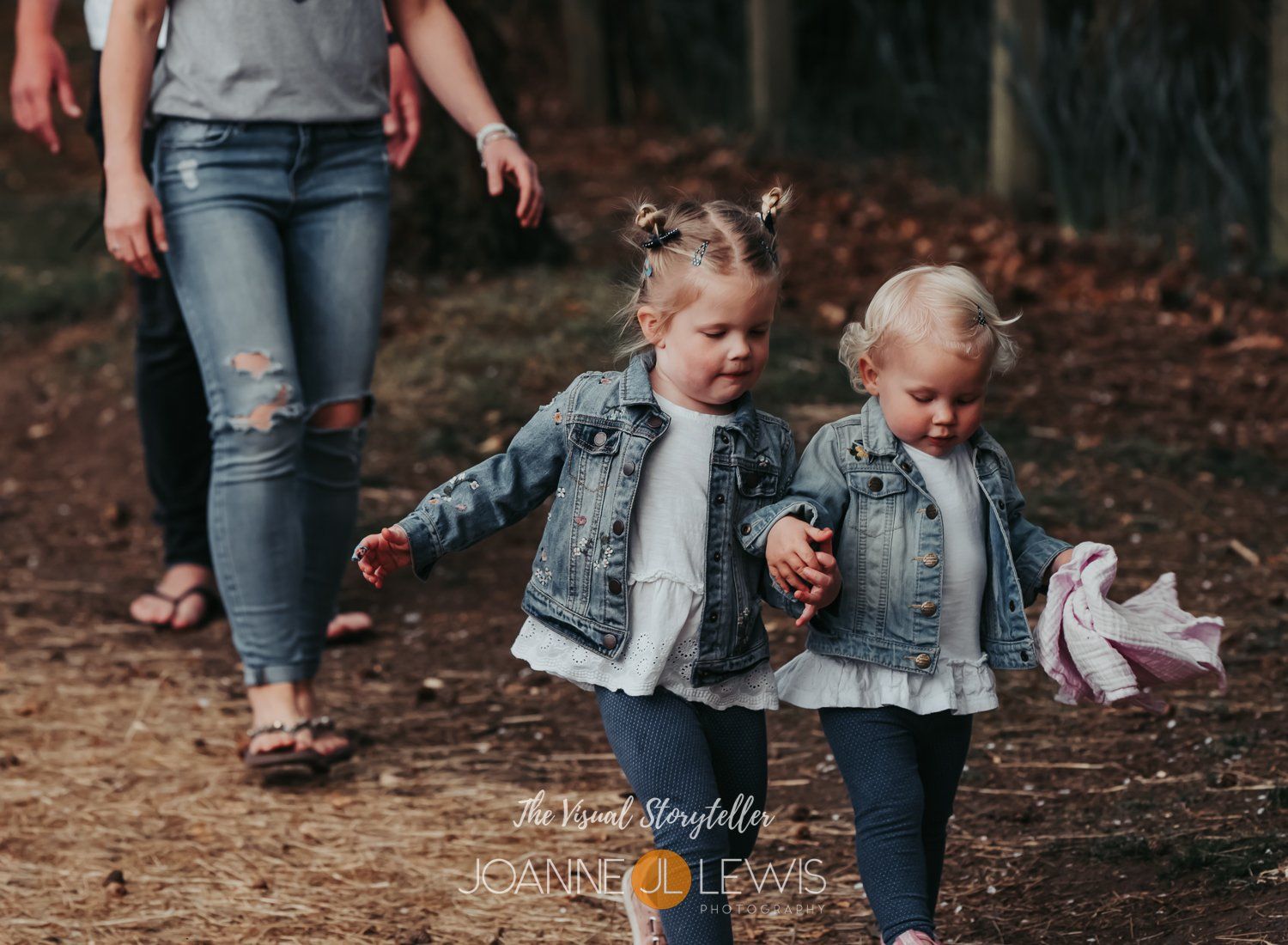two girls walking in the woods