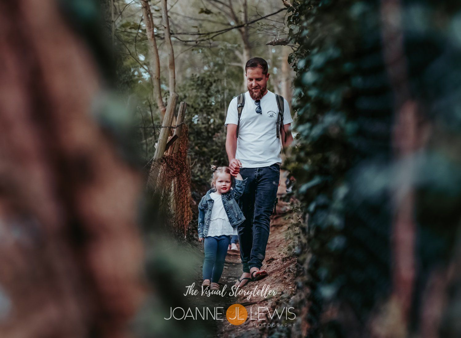 young girls and her father walking in the woods