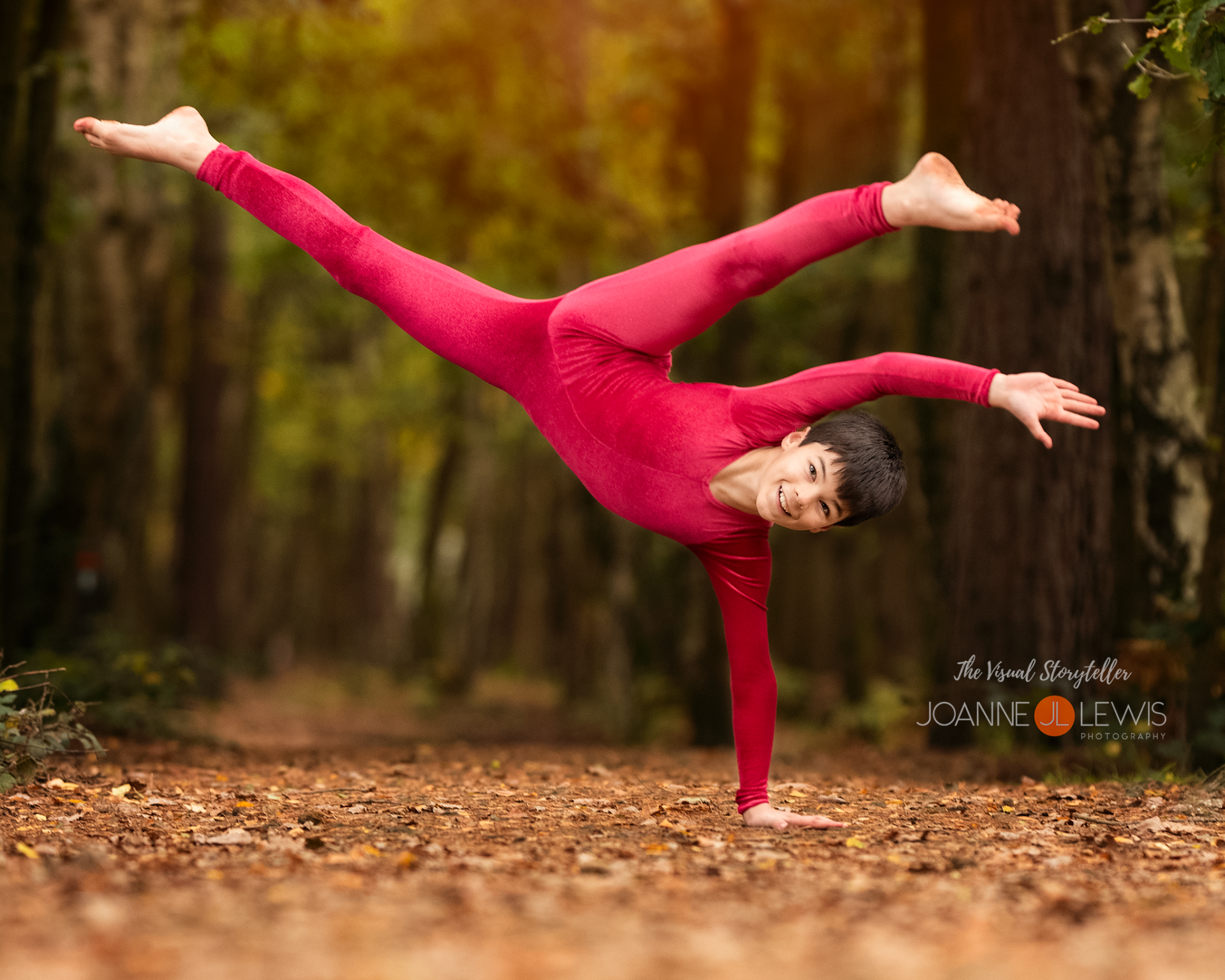 Acrobatic male dancer being photographed in the woods