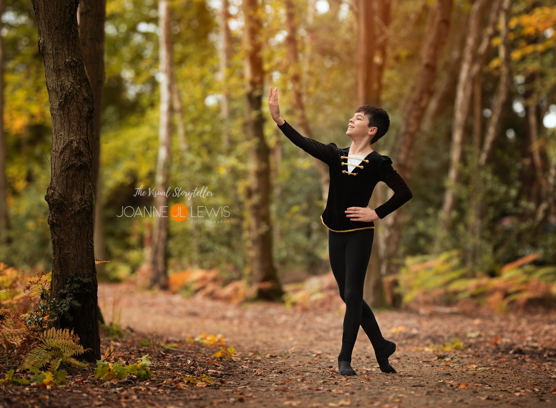 Ballet boy posing in the forest