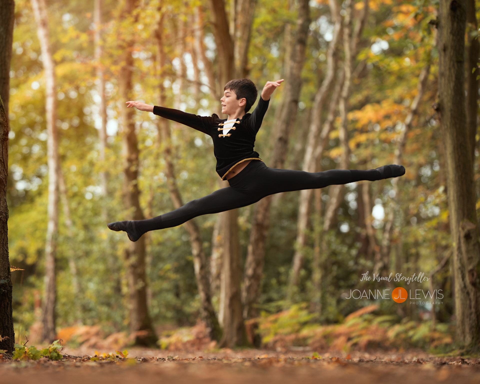 Male dancer jumping for photographs in the forest