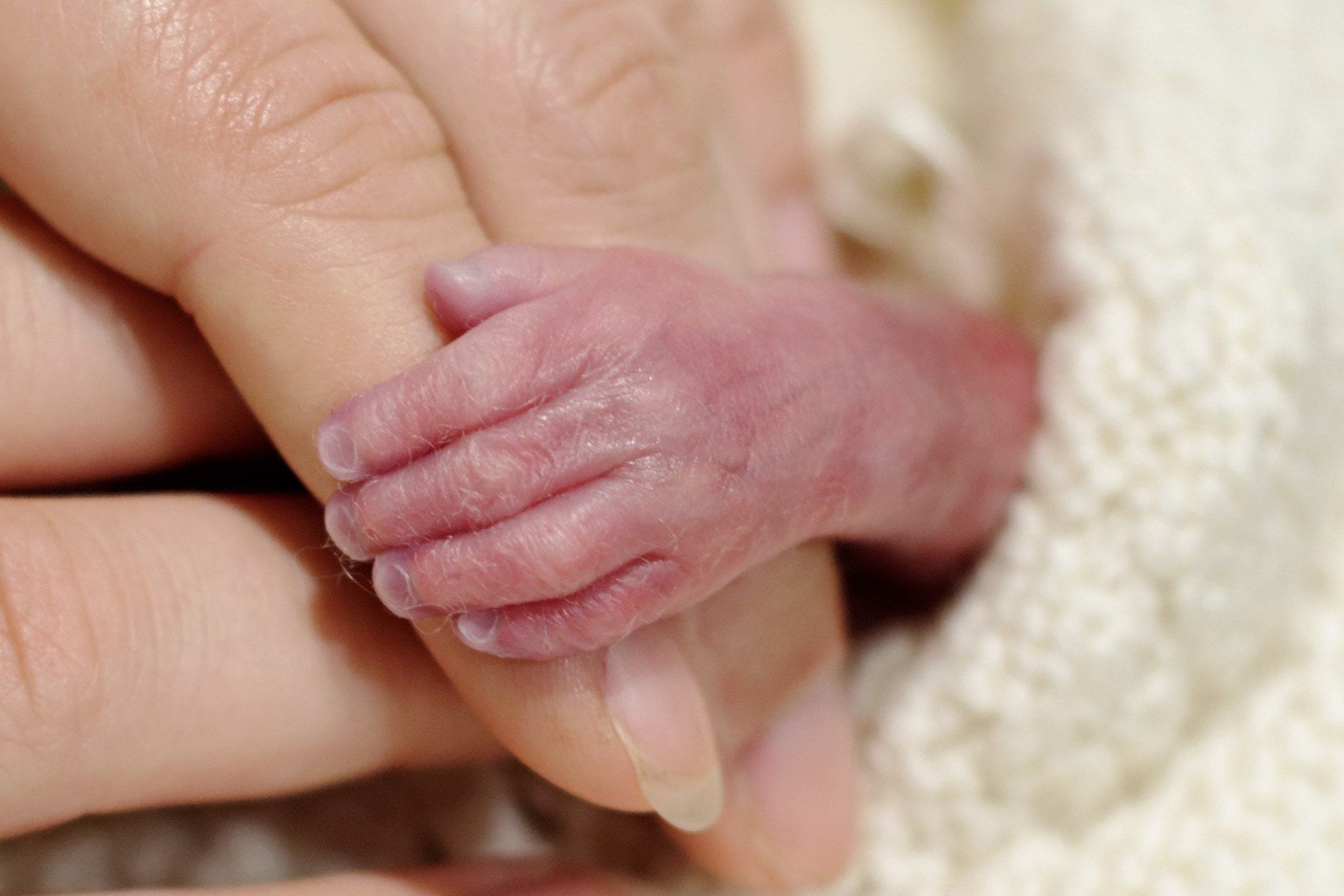 Phoenix's tiny little hand holding mummy finger