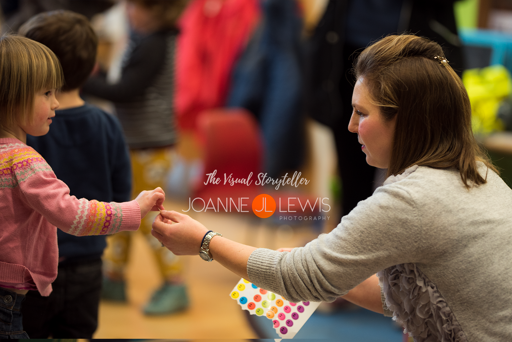 Handing out stickers during a children's pre-school class