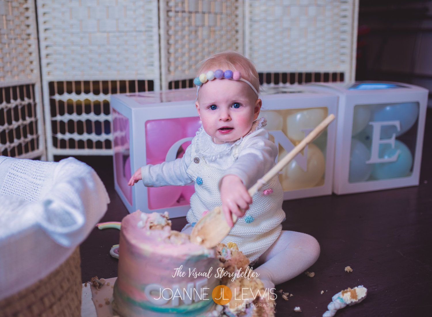 Cake smash using large wooden spoon