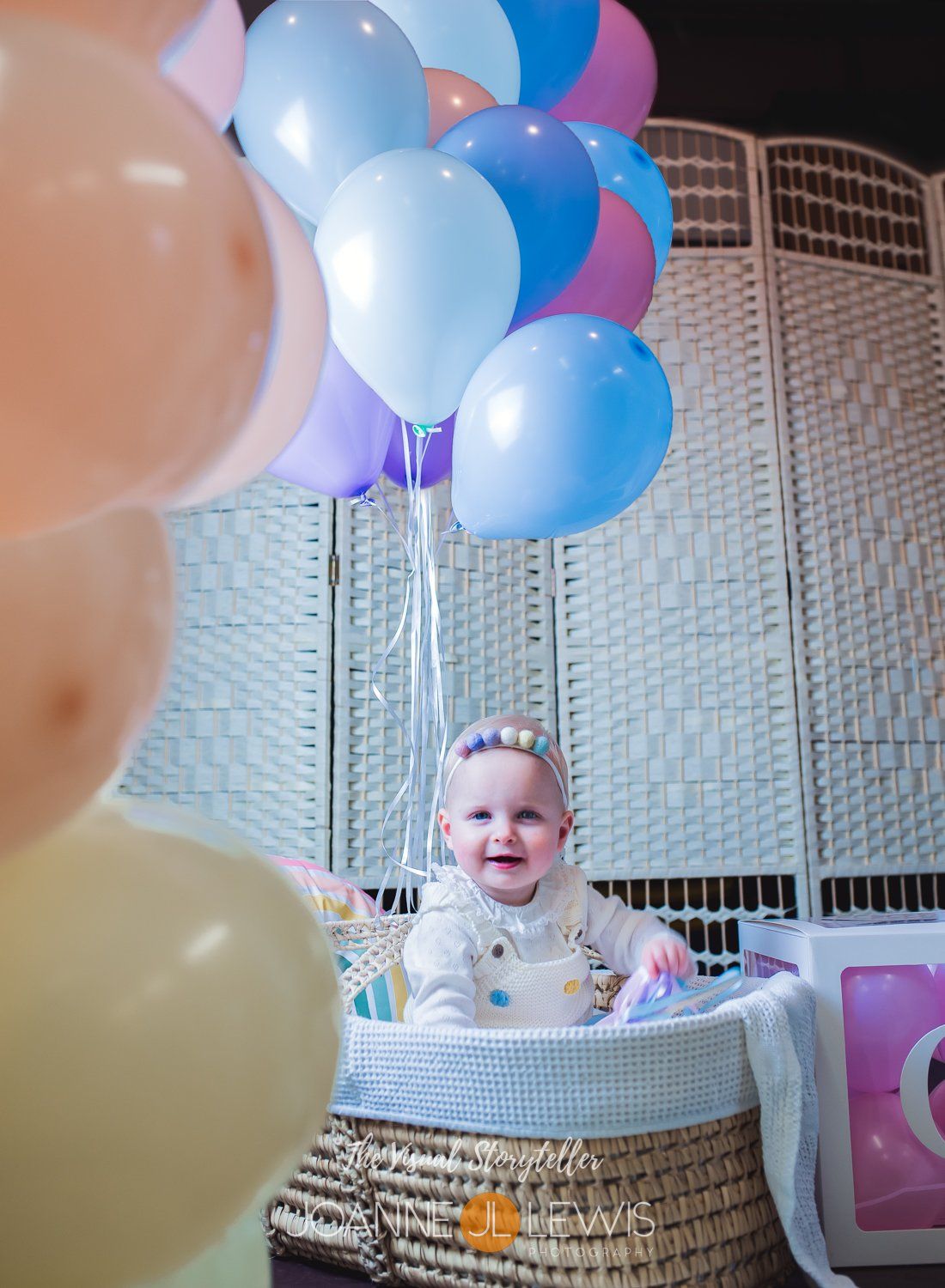 Baby girl in Basonnet tied to balloons lady to fly to the sky like in the movie UP