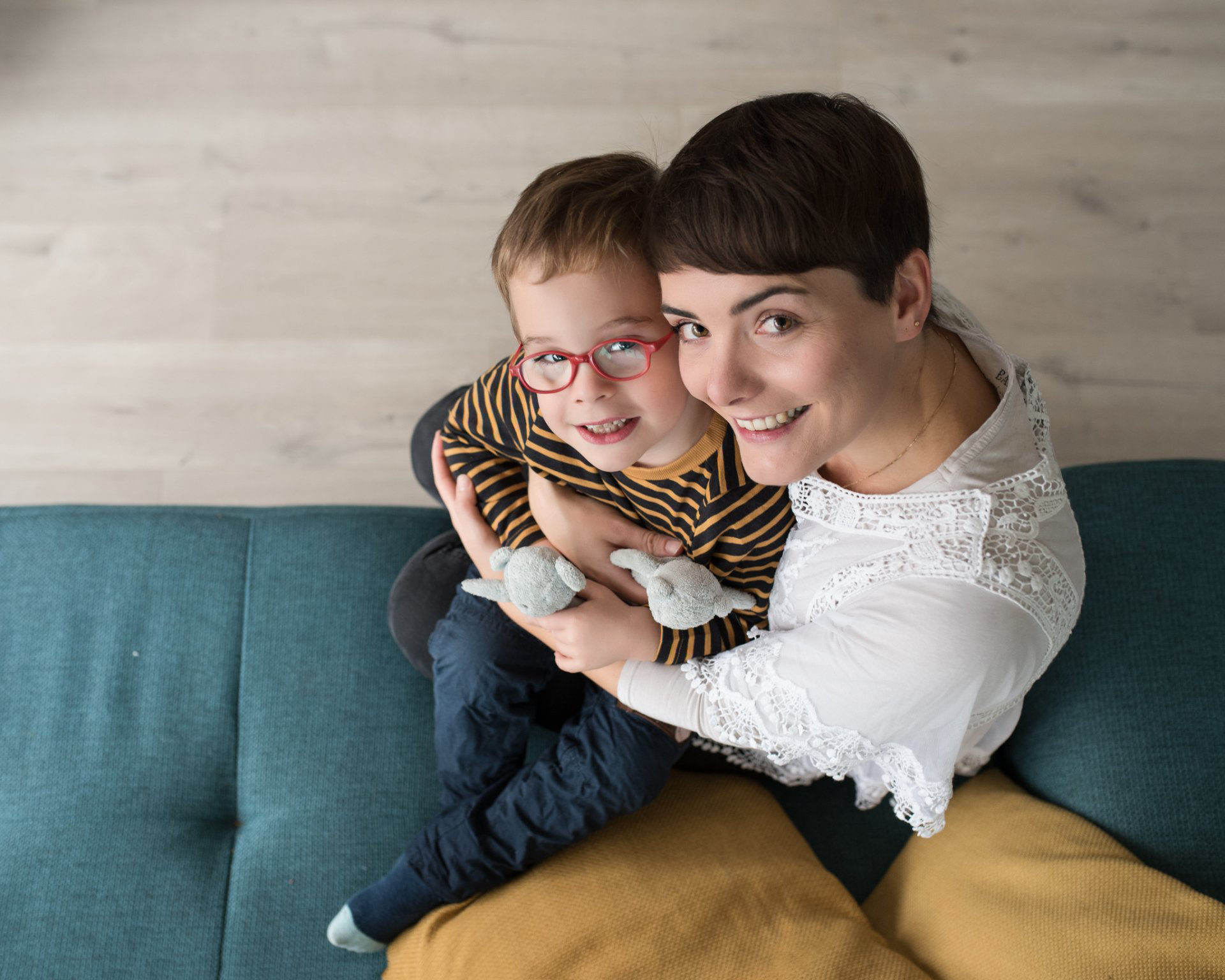 Mother and child sitting with toys