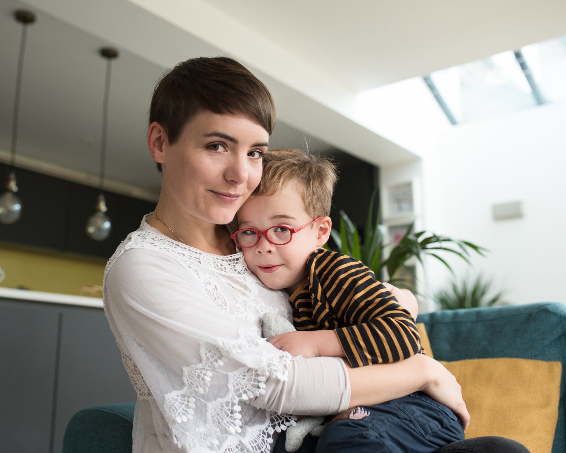 Mother cuddles he beautiful son