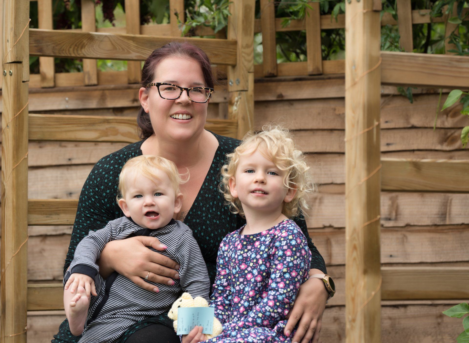 Sam, Alice and Lucas sitting on bench thinking of Connor