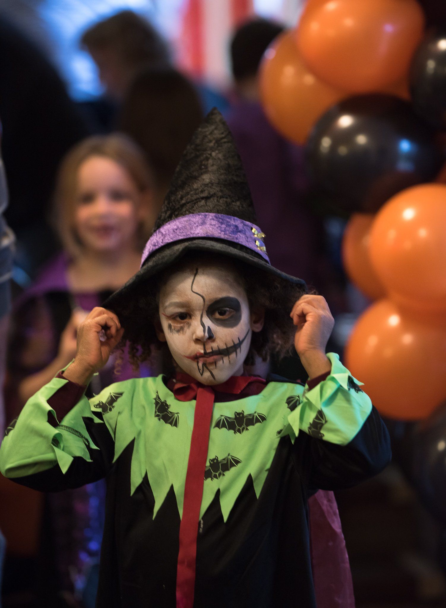 young boy in amazing scary halloween costume with creepy make up