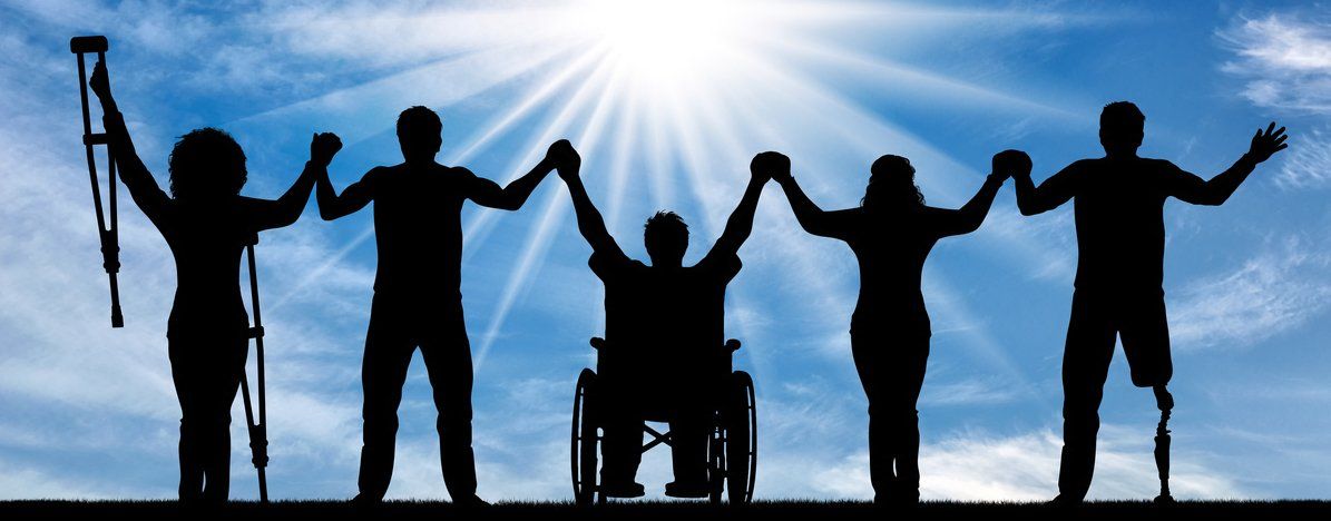 Silhouettes of people with with mobility difficulties. They are looking at a bright sun in the sky.