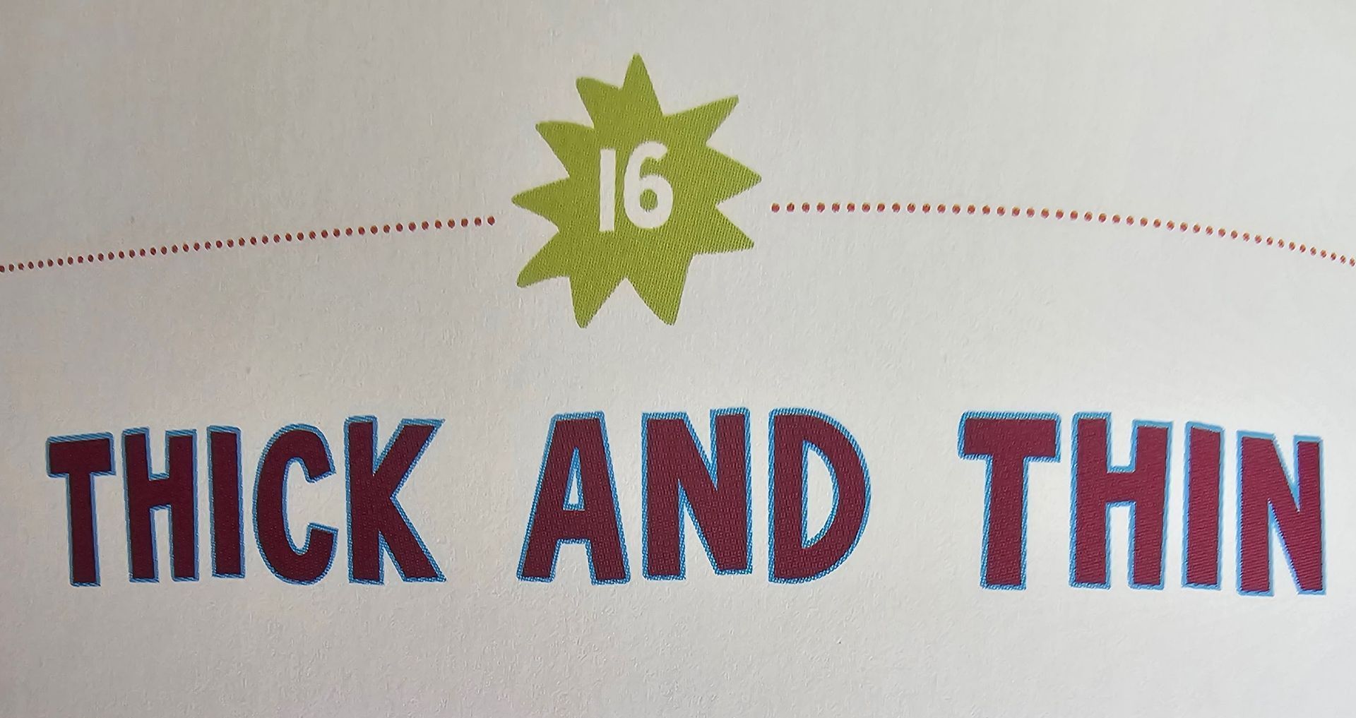 Inside the book showing an outlined capitalised font.