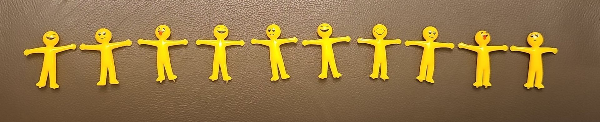 A row of rubber stretchy people fidget toys