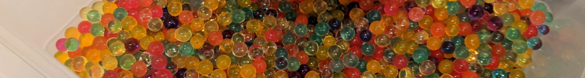 A narrow view of water beads in a tub.