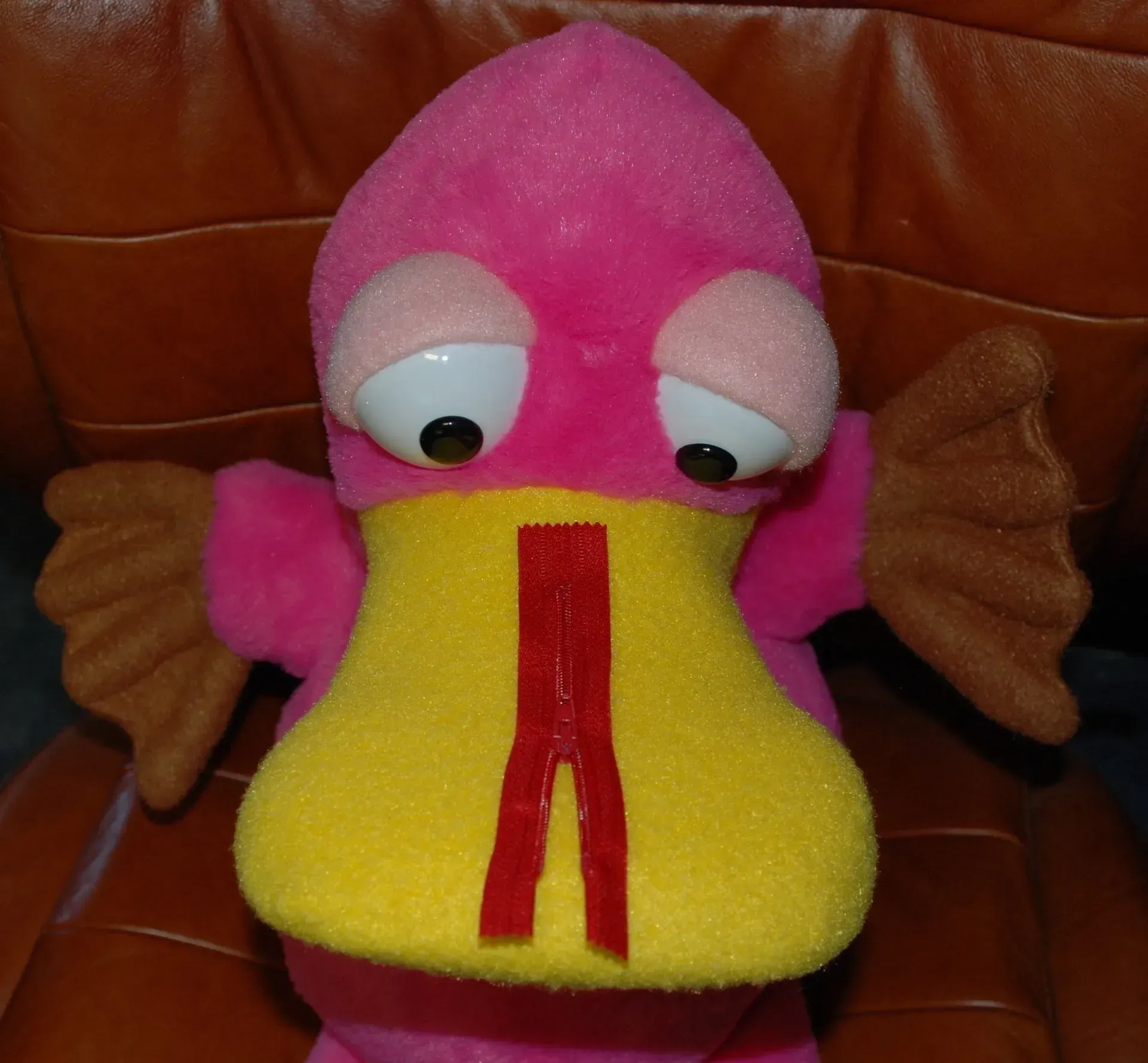 Theo the Pondering Platypus with a zip sitting on his beak