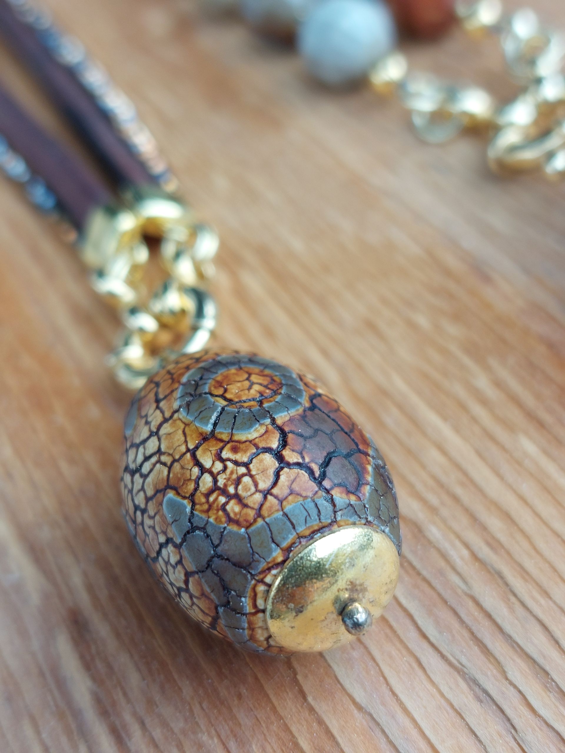 blau-goldener Kettenanhänger