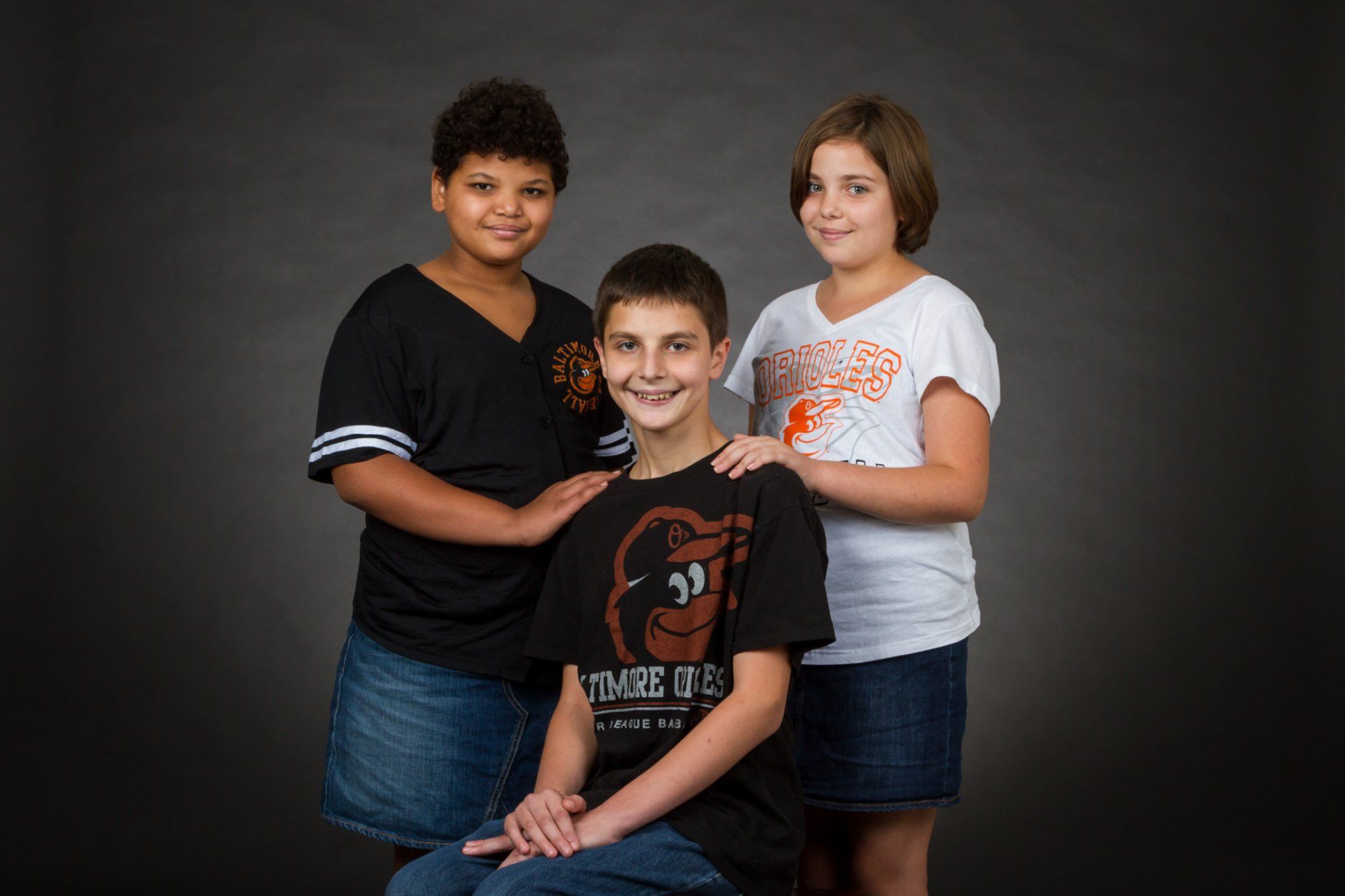 Three siblings in the studio for a portrait.