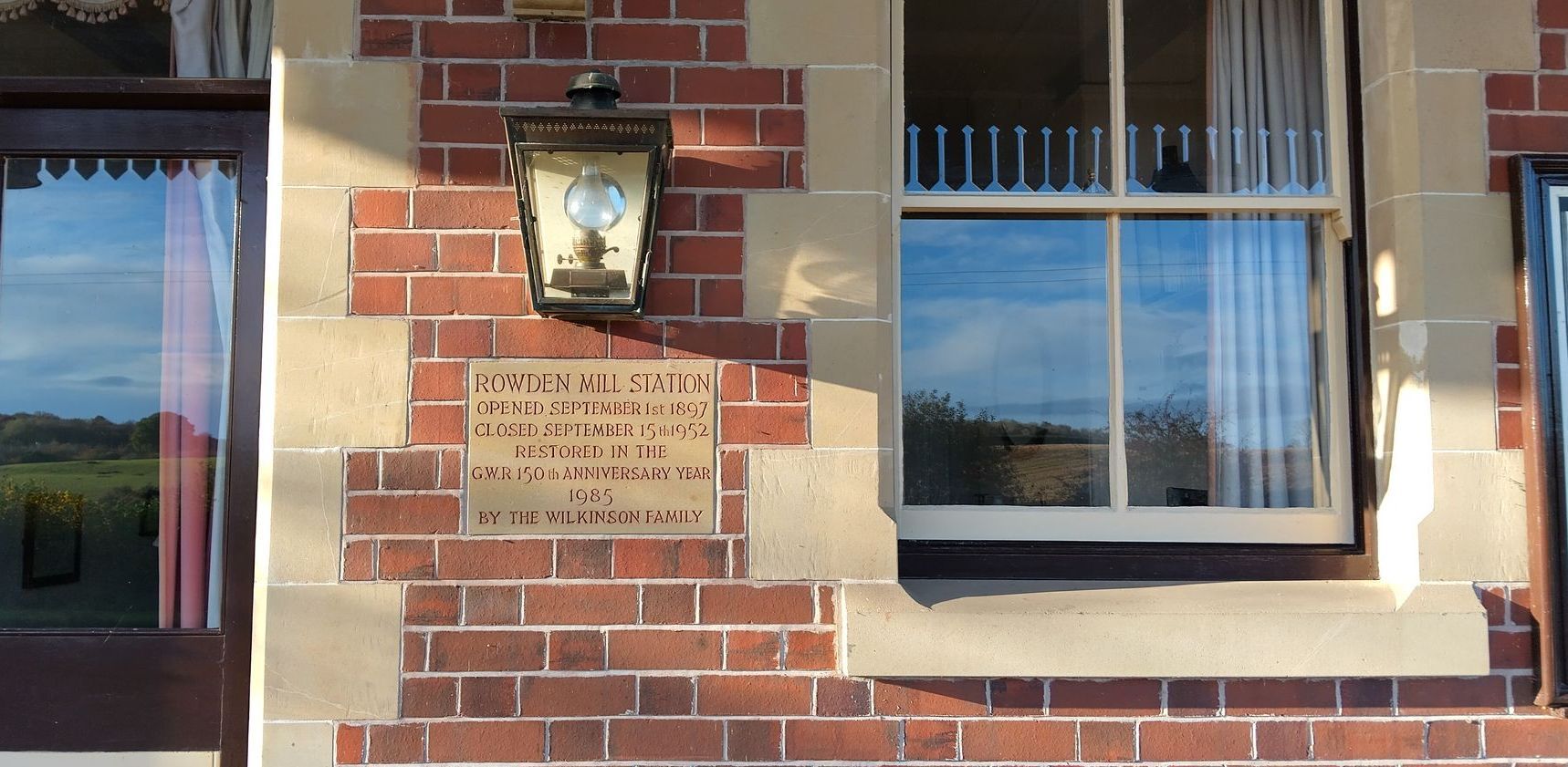 The history of the station can be read from a stone plaque on the wall: 'opened in 1897, closed in 1952'