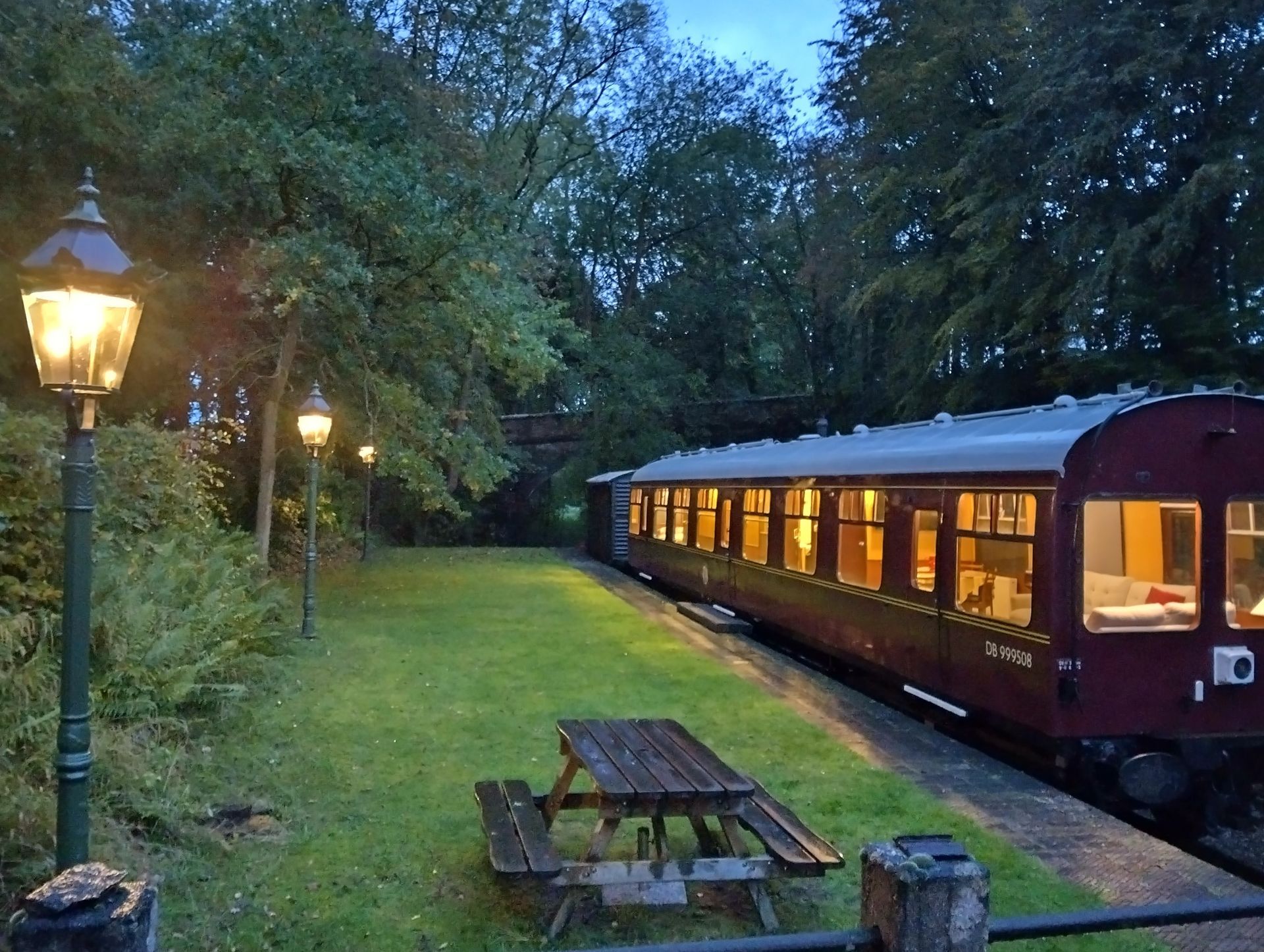 The green 'Platform 2' at Rowden Mill Station houses the Saloon Coach DB999508 - our 1960's railway carriage that sleeps 4 guests