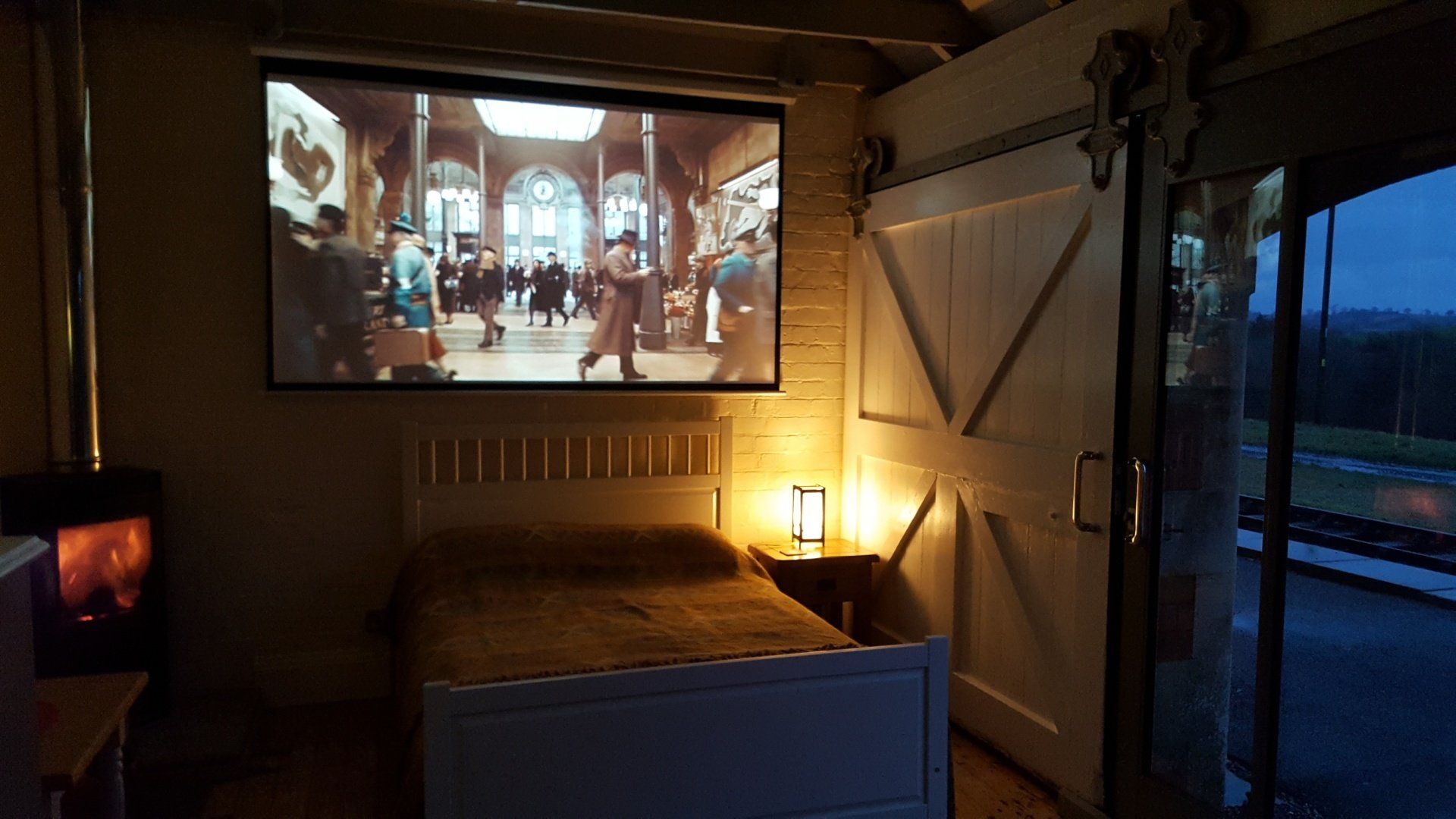 The Parcel Office is a self-contained studio for a couple has a fabulous home-cinema and catch-up TV. with a wood-burning stove that makes the place so cosy over winter