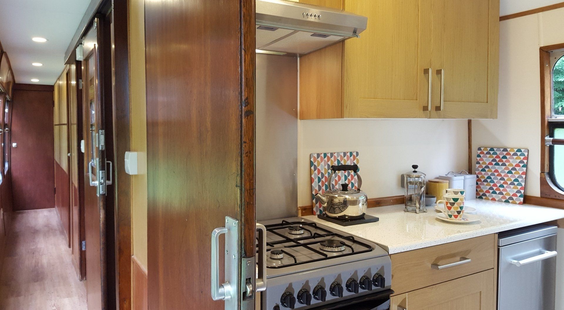 The modern fully-fitted kitchen in the railway carriage is its original space where railway engineers were once tended by a chef in full whites