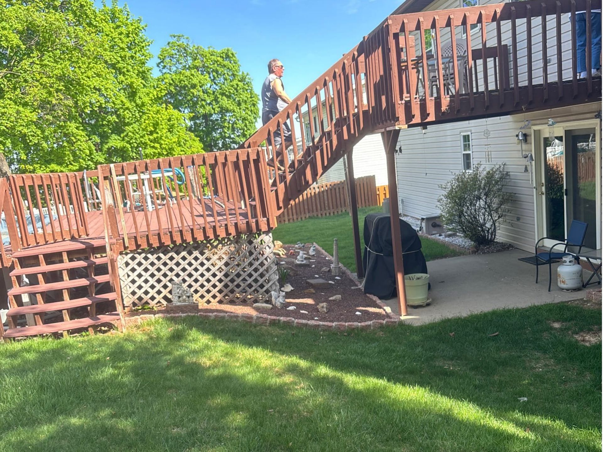 Before photo showing old deck before remodel by Kitchen And Bath Remodeling Plus