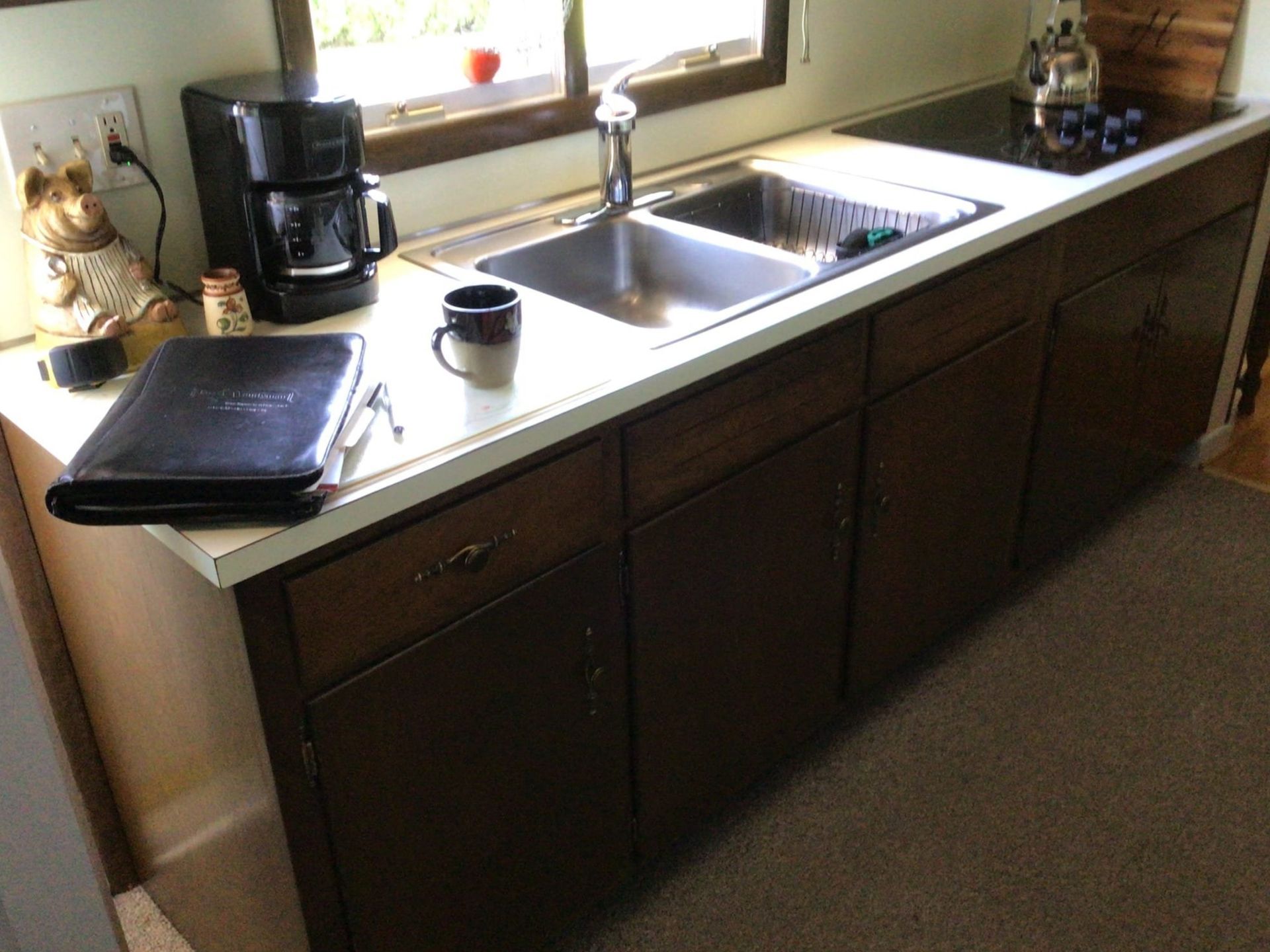 Kitchen sink and countertop before renovation by Kitchen And Bath Remodeling Plus