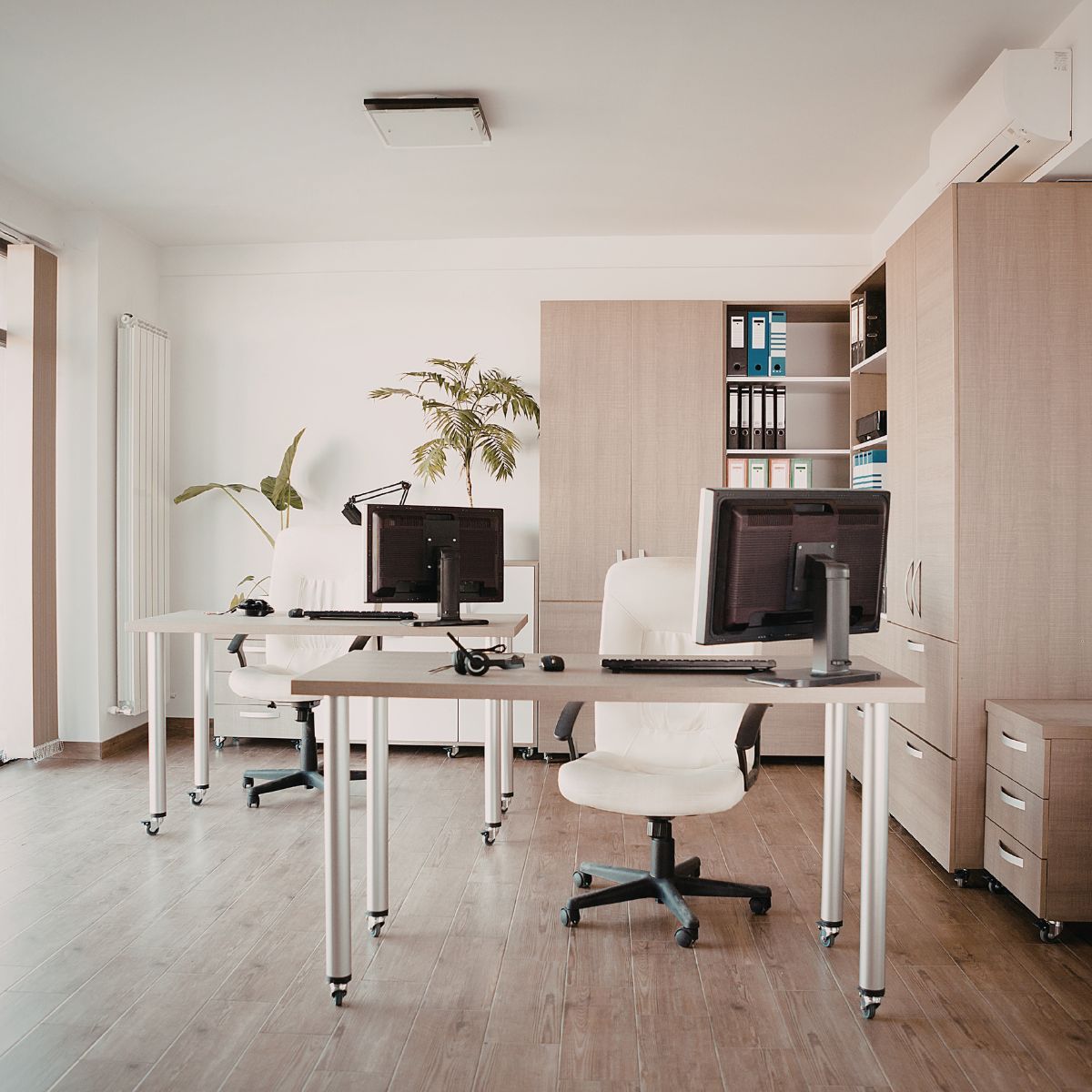 Optimize your office layout Modern home office layout with desks, storage cabinets, and natural light