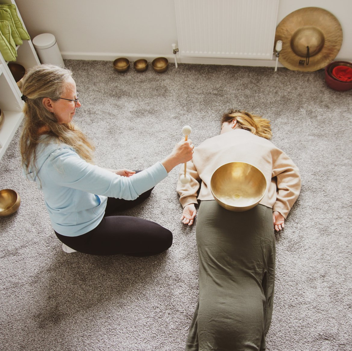 two Woman with singing bowls