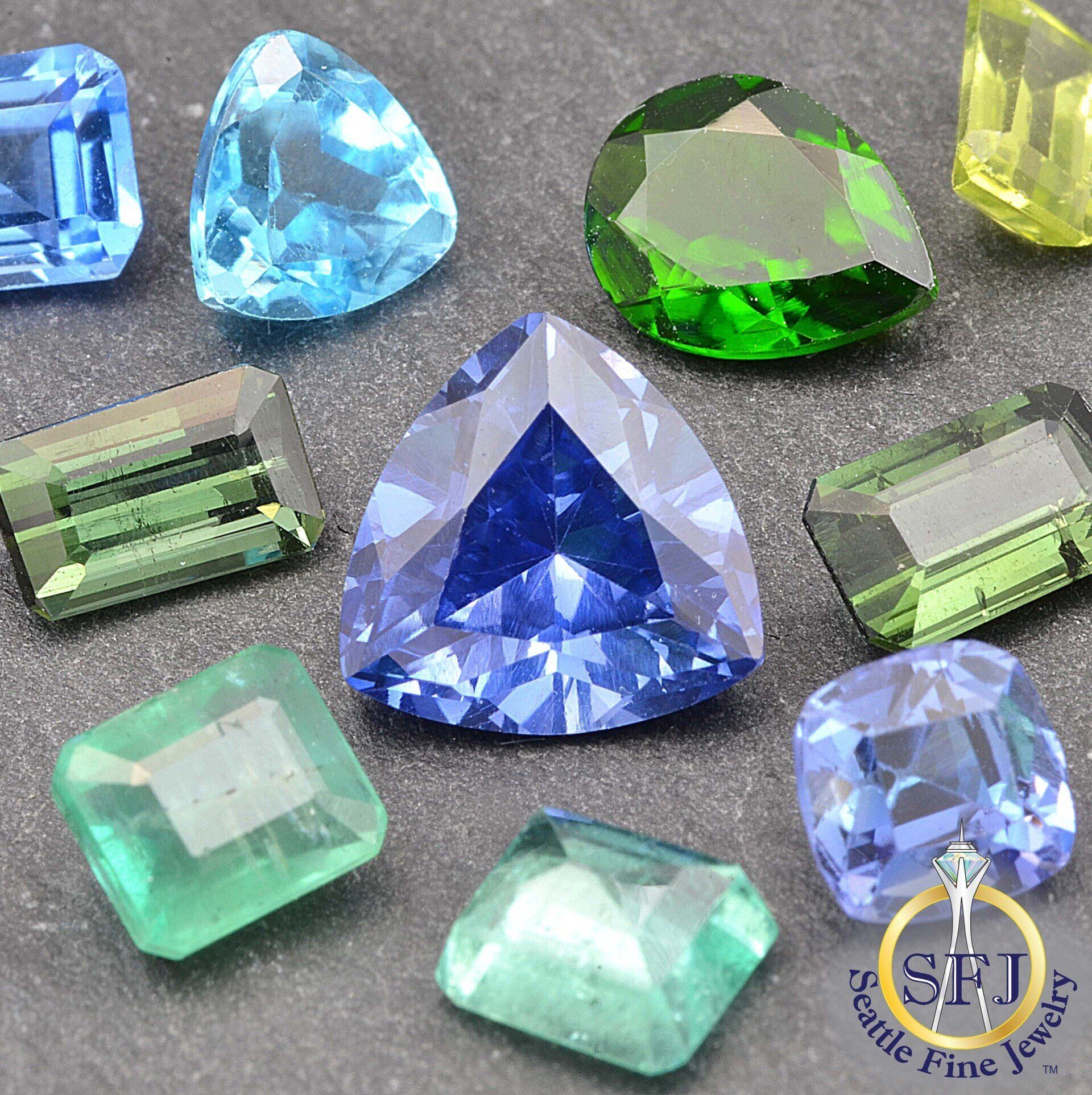 Loose gems loose gemstones sapphire peridot emerald chrome diopside tourmaline topaz tanzanite Seattle Fine Jewelry SFJ