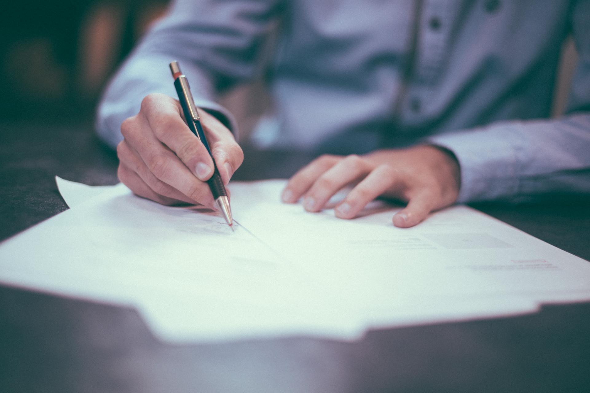 Business owner signing a Will
