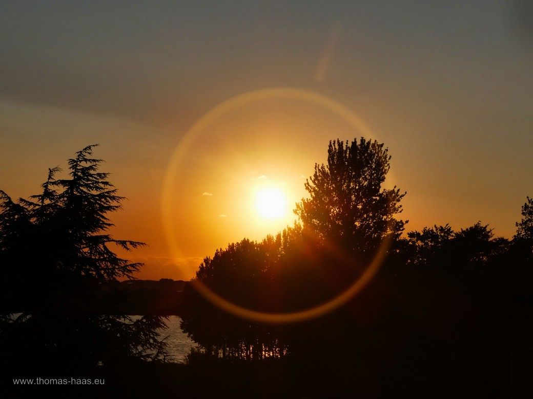 Sonnenuntergang an der Schlei mit Reflektion vom Objektiv, Juli 2024