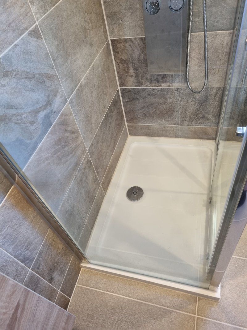 New shower tray installed in a bathroom renovation project by R Howells