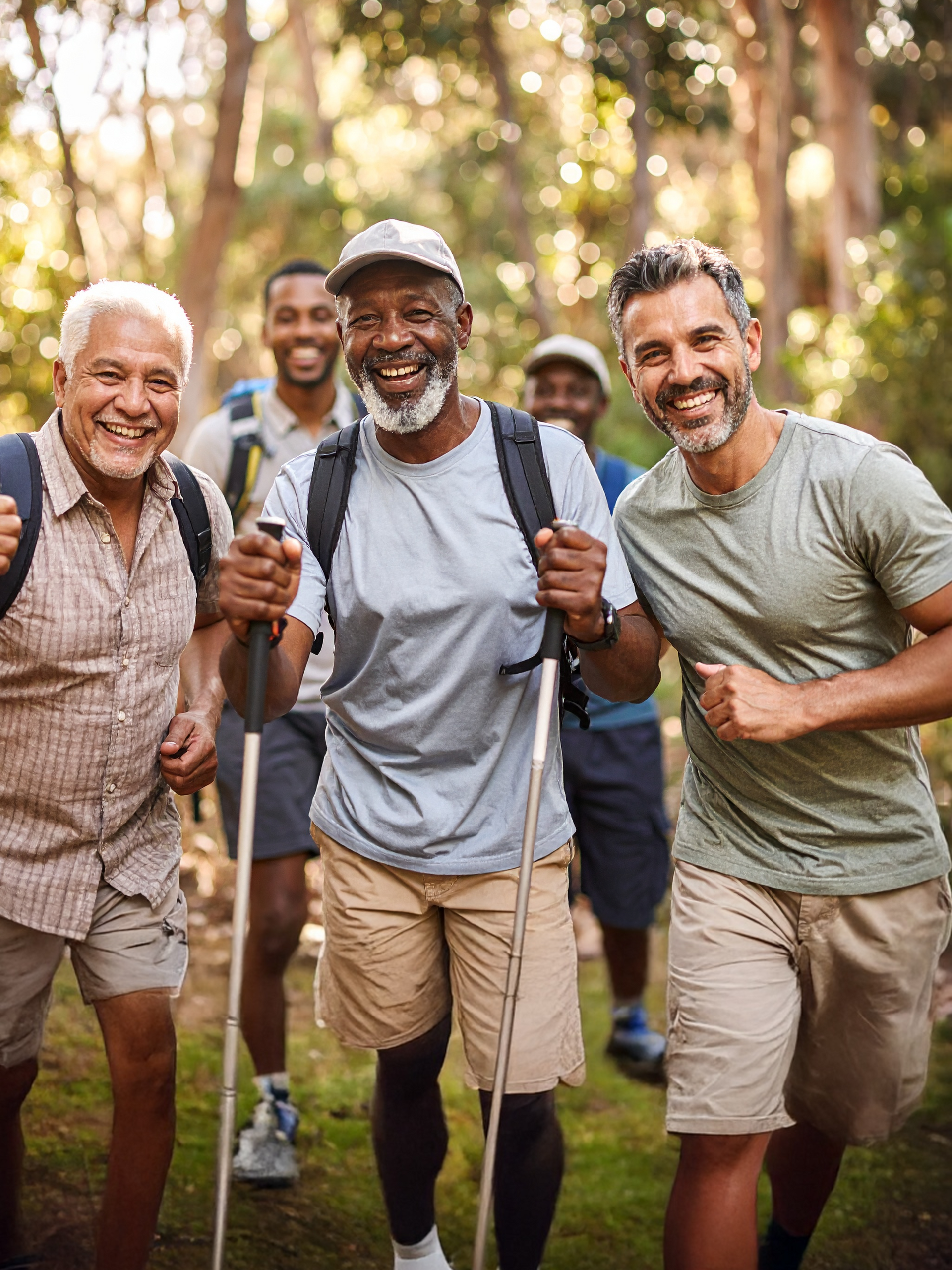 Group of men over 50 hiking and smiling