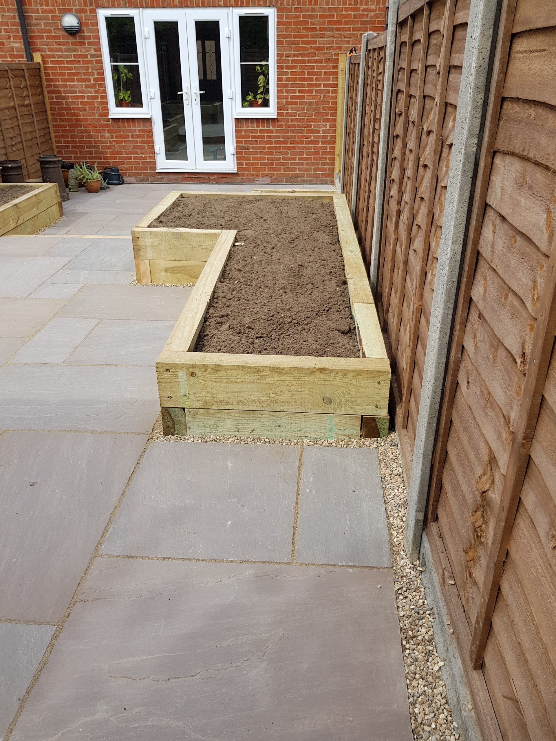 Wooden planter and paving