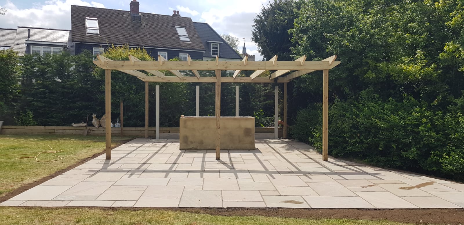Wooden pergola and paving