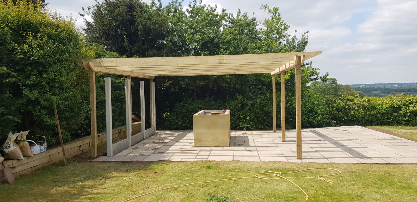 Wooden pergola and paving