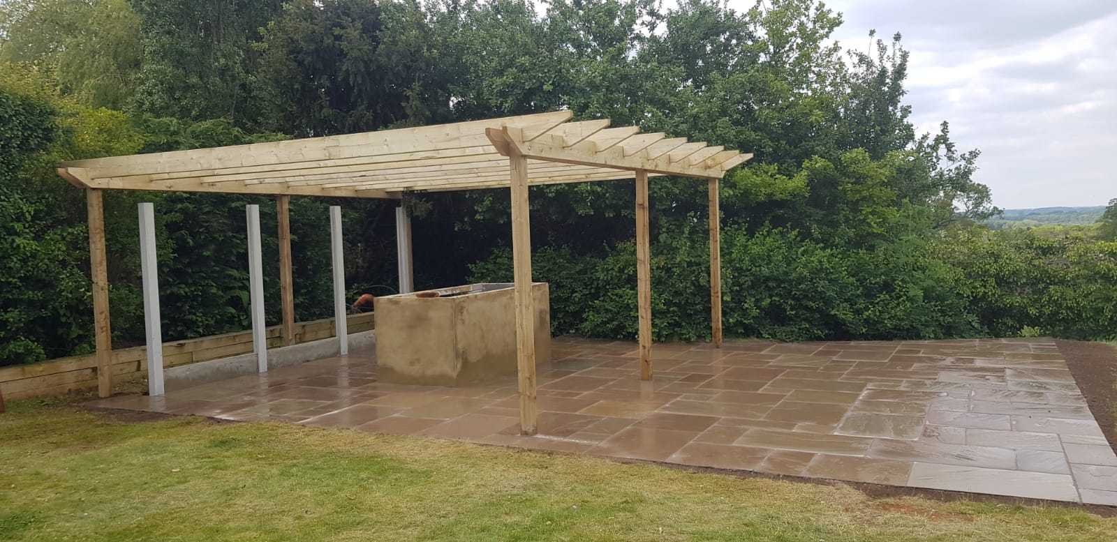 Wooden pergola and paving