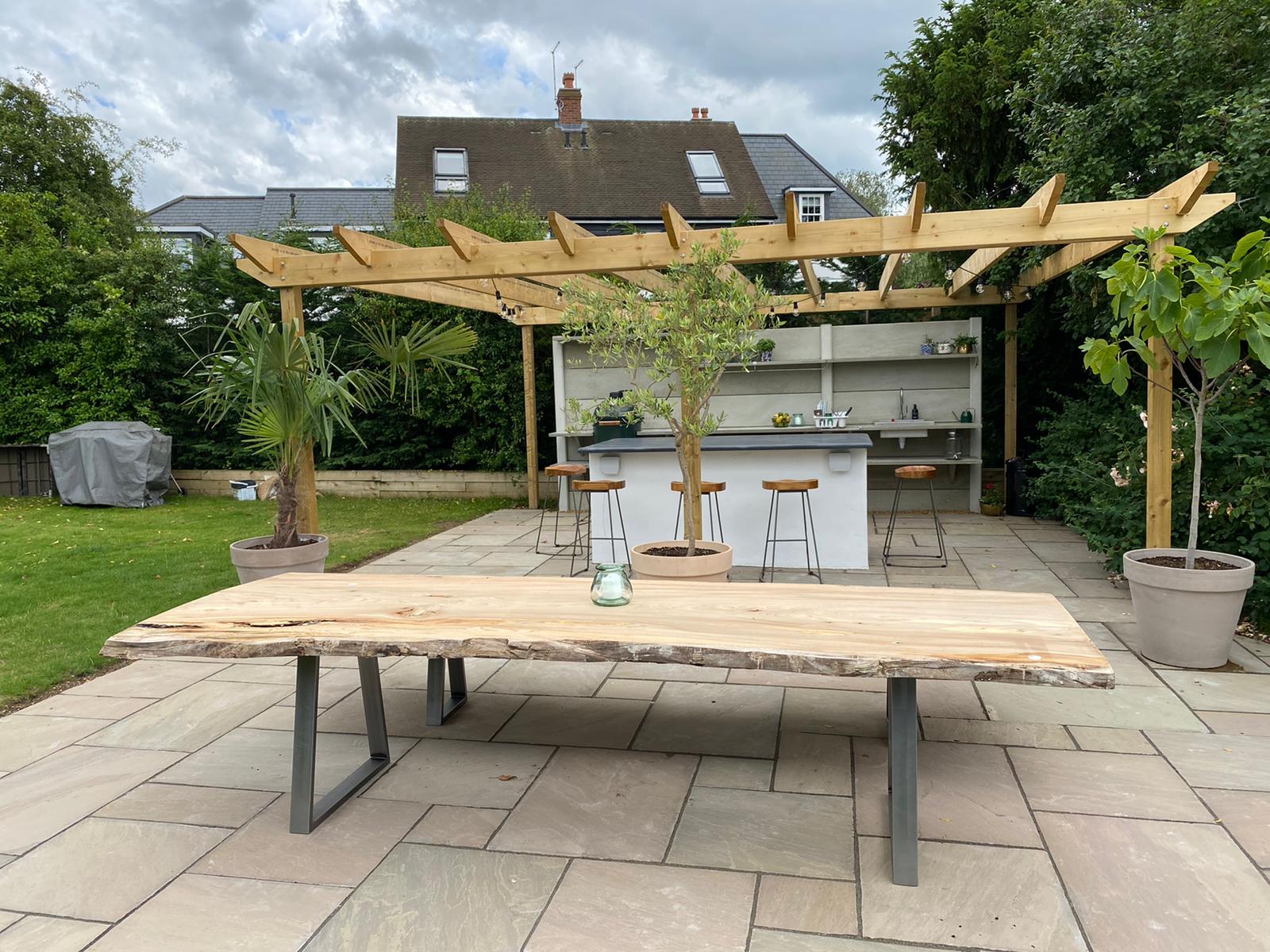Wooden pergola and paving
