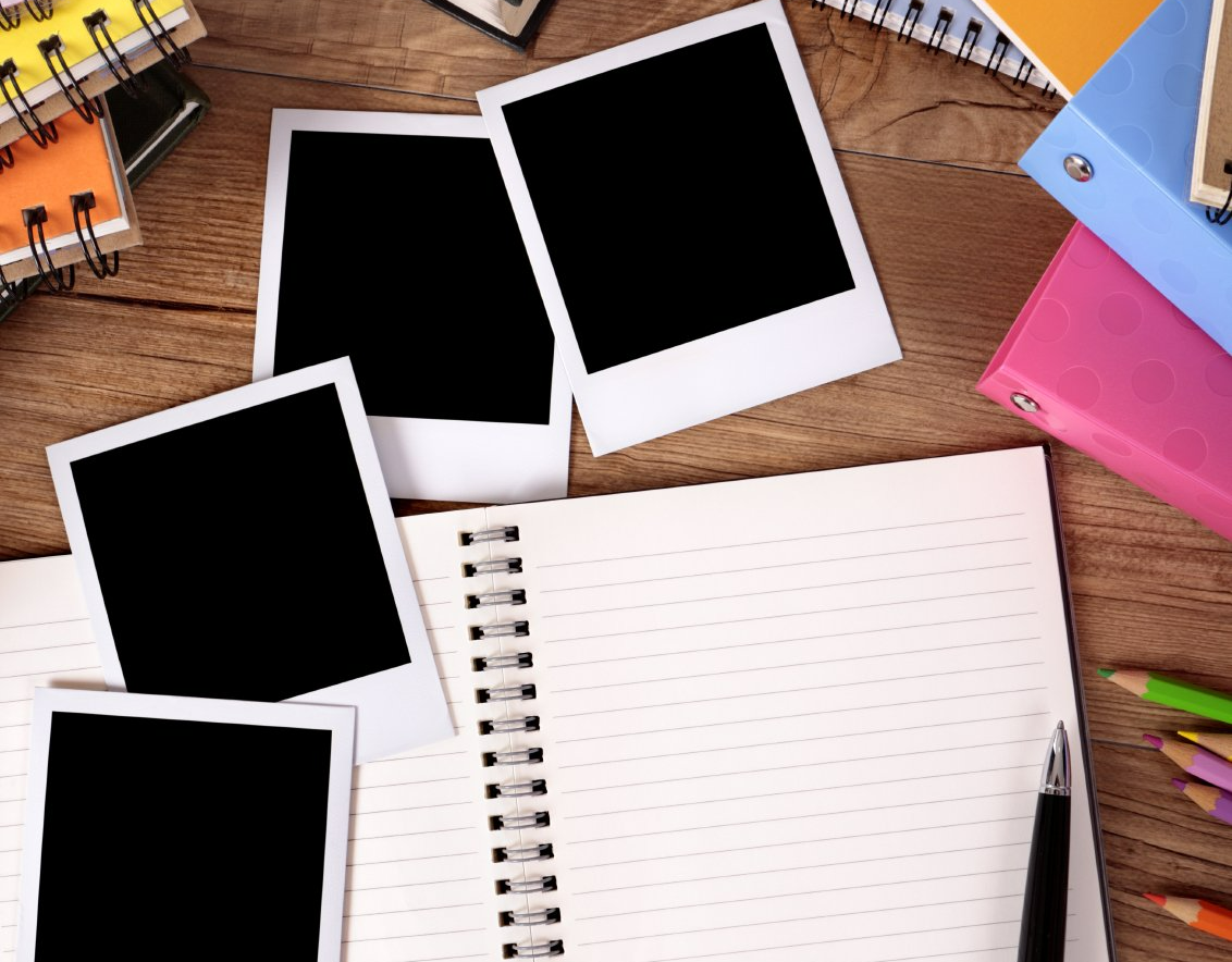 A journal, pencils, and polaroid photographs.