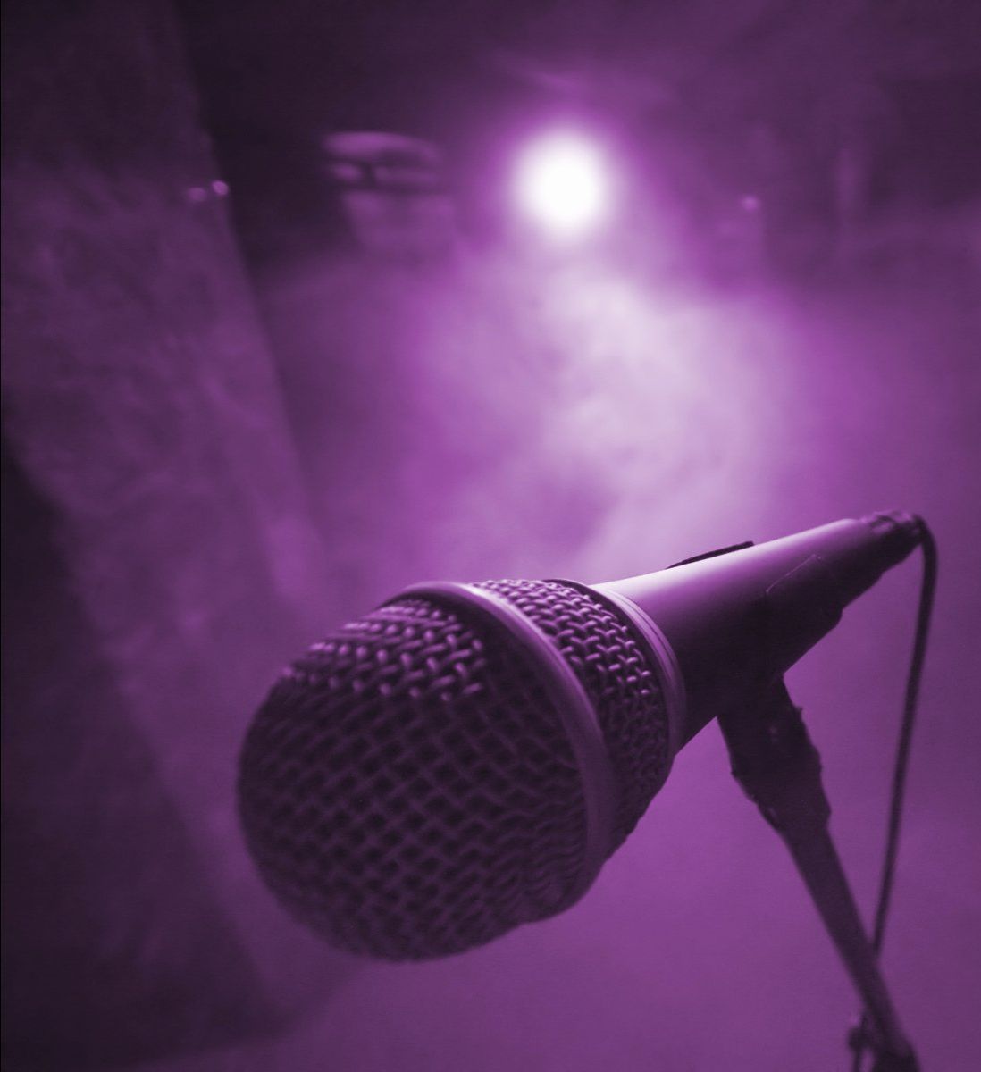 A microphone on a purple background.