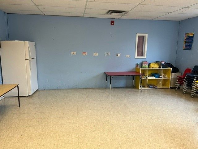 The party room with table and chairs.