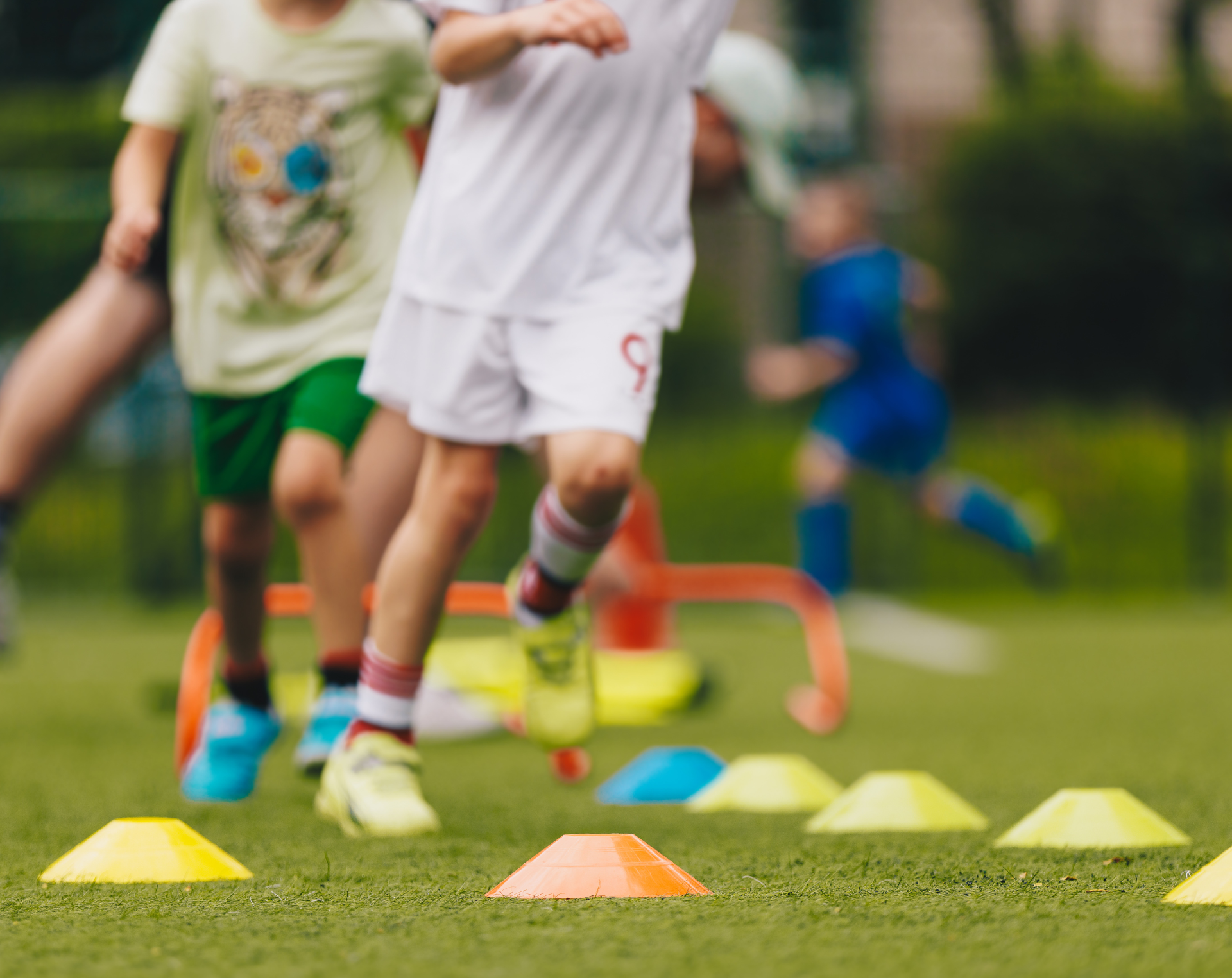 Children running a small obstacle course.