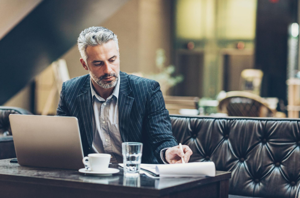 Licensed physician conducting a personalised executive health assessment with a private patient