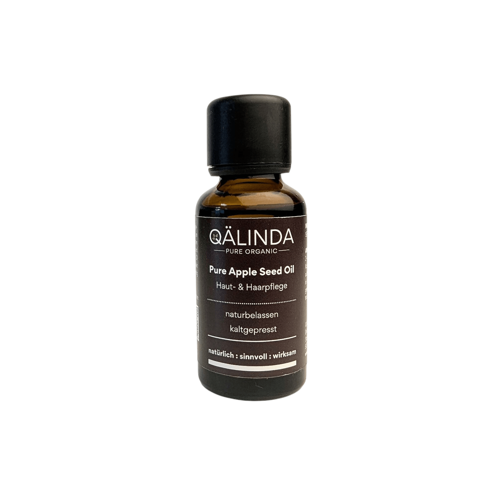 Reines kaltgepresstes Apfelkernöl in der Braunglasflache mit Tropfer