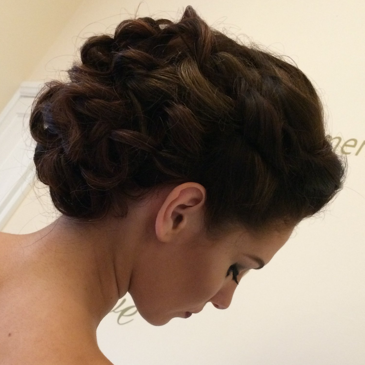 student getting hands on for hair up course